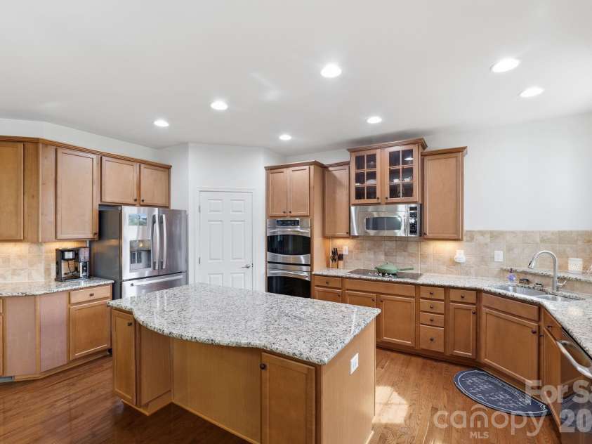 8480 Penton Place, Harrisburg, NC 28075.  MLS# CAR4349630, YatesRealty ID 22713. Gourmet Kitchen double oven