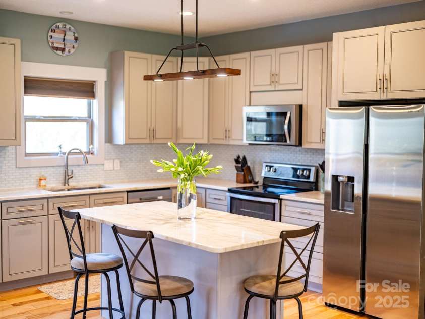 223 Reilly Drive, Leicester, NC 28748.  MLS# CAR4310121, YatesRealty ID 22714. Kitchen - bright & airy.