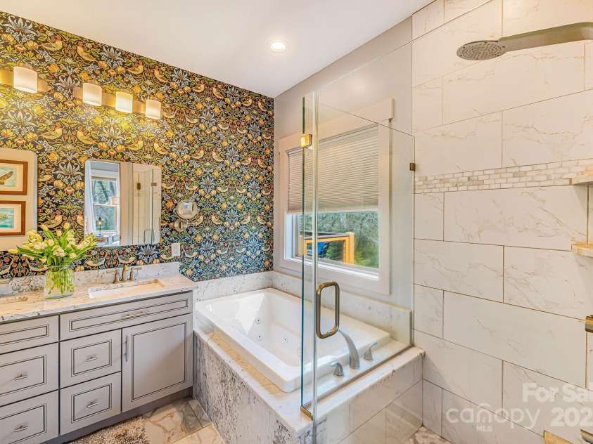 223 Reilly Drive, Leicester, NC 28748.  MLS# CAR4310121, YatesRealty ID 22714. Primary ensuite with shower and soaking tub!