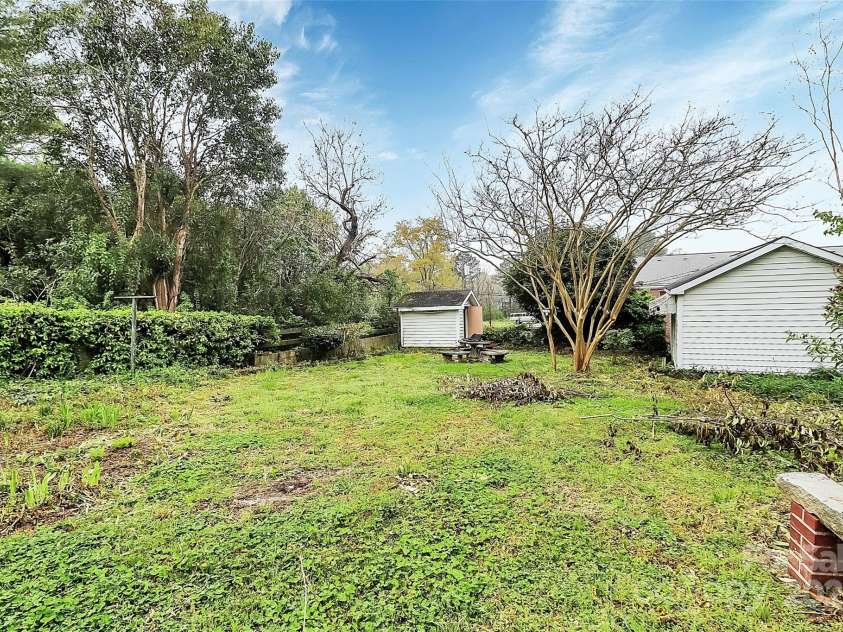 105 Deaver Street, Chester, SC 29706.  MLS# CAR4242410, YatesRealty ID 22718. Backyard with a workshop & shed