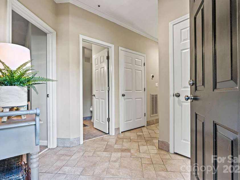 1007 Southwest Drive, Davidson, NC 28036.  MLS# CAR4271868, YatesRealty ID 22720. Inviting entryway with coat closet