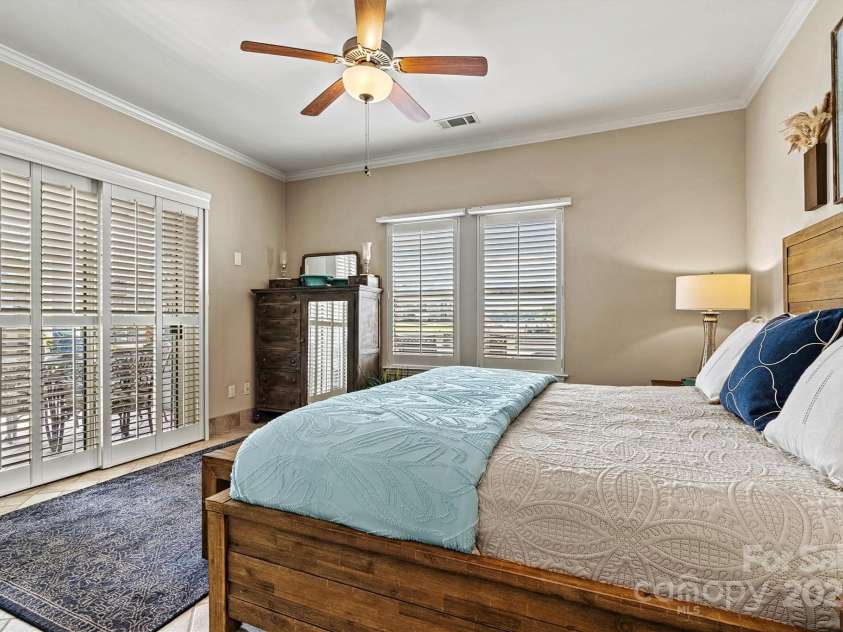 1007 Southwest Drive, Davidson, NC 28036.  MLS# CAR4271868, YatesRealty ID 22720. Primary bedroom has plantation shutters
