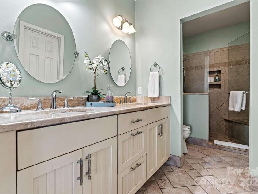 1007 Southwest Drive, Davidson, NC 28036.  MLS# CAR4271868, YatesRealty ID 22720. Remodeled primary bath with double sinks and large shower