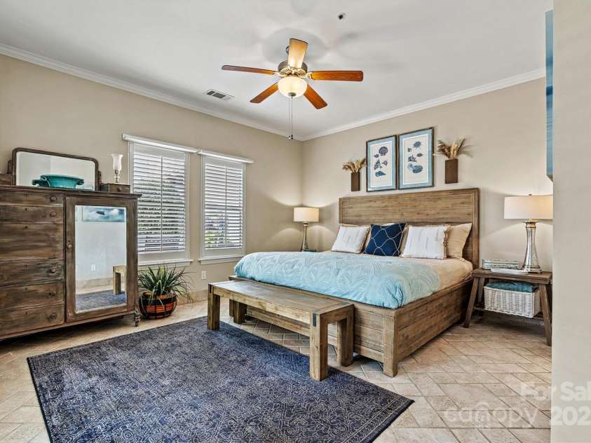 1007 Southwest Drive, Davidson, NC 28036.  MLS# CAR4271868, YatesRealty ID 22720. Spacious primary bedroom with lots of natural light