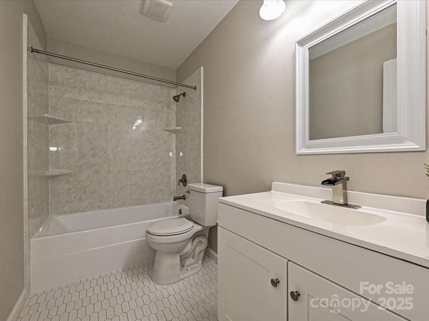 7916 Charter Oak Lane, Charlotte, NC 28226.  MLS# CAR4272766, YatesRealty ID 22722. Downstairs bathroom