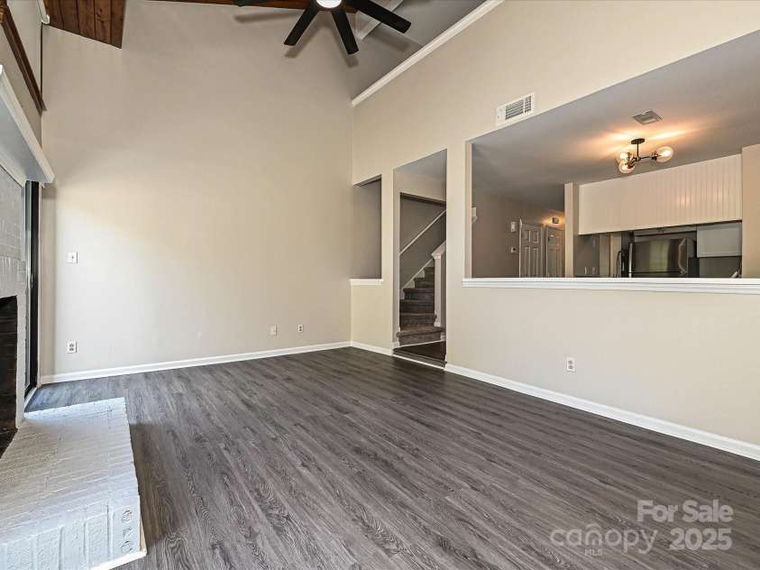 7916 Charter Oak Lane, Charlotte, NC 28226.  MLS# CAR4272766, YatesRealty ID 22722. New Fan in Living Room Area