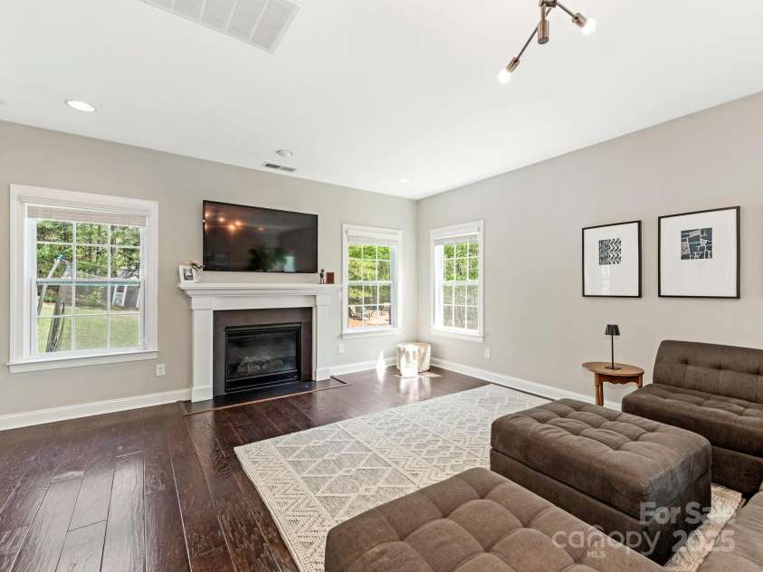 10201 Daufuskie Drive, Charlotte, NC 28278.  MLS# CAR4251189, YatesRealty ID 22723. Living room with gas fireplace