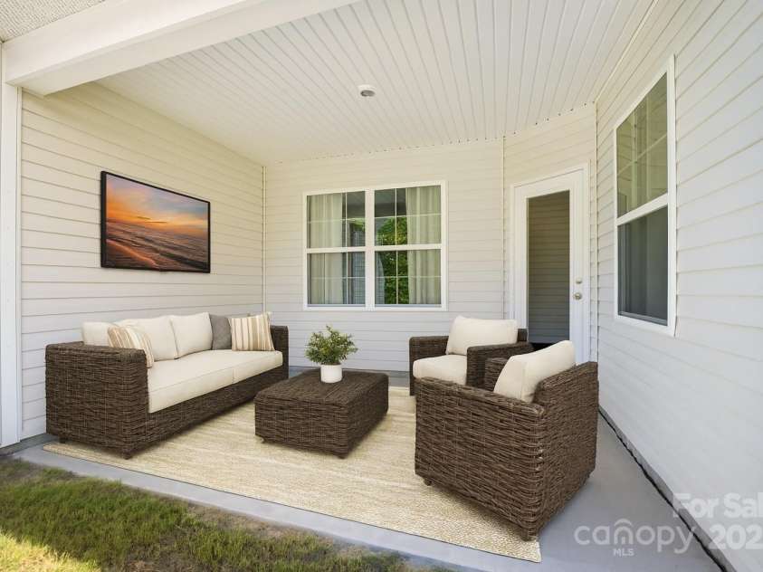 147 Dubois Drive, Mooresville, NC 28115.  MLS# CAR4309004, YatesRealty ID 22724. Outdoor covered patio for relaxing  virtually staged