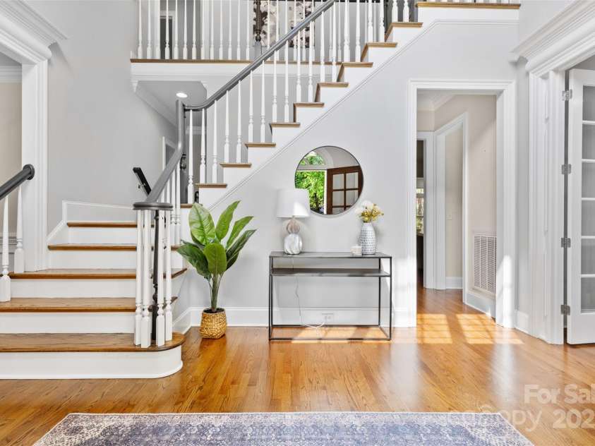 1806 Asbury Hall Court, Charlotte, NC 28209.  MLS# CAR4265884, YatesRealty ID 22727. Foyer filled with natural light has stairs leading to bedrooms upstairs.