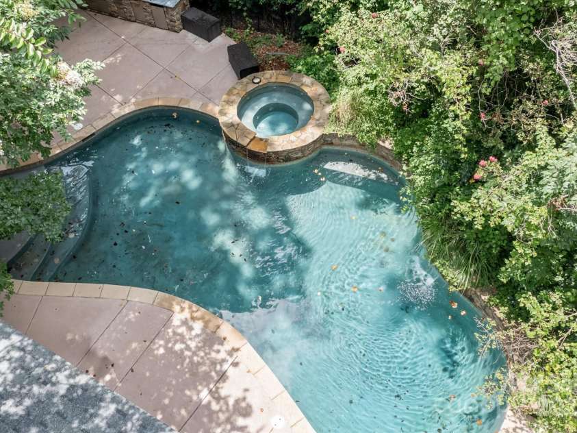 1806 Asbury Hall Court, Charlotte, NC 28209.  MLS# CAR4265884, YatesRealty ID 22727. Pool, hot tub in private and serene backyard.