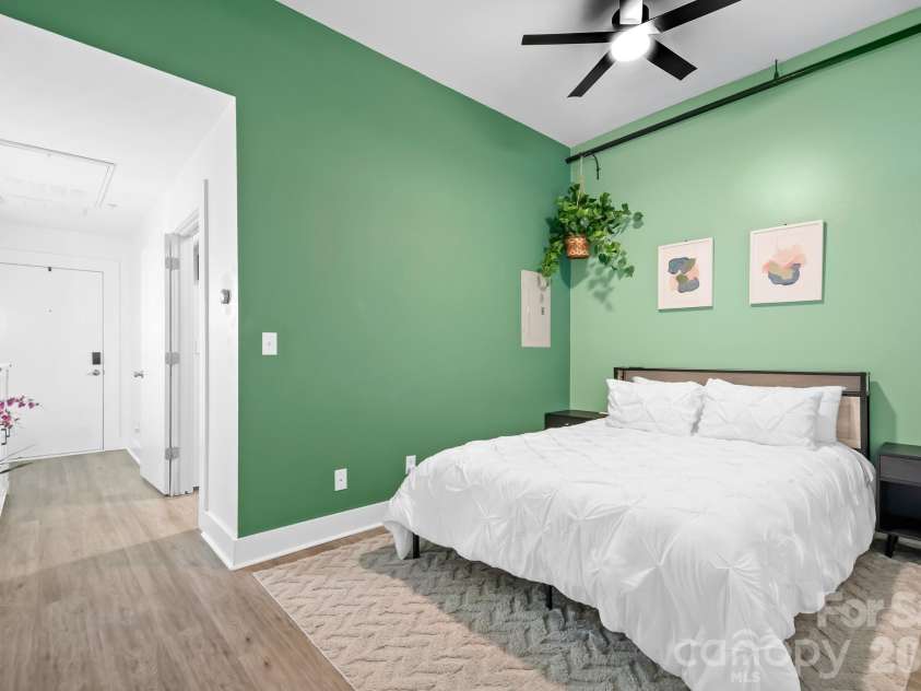 1611 Central Avenue, Charlotte, NC 28205.  MLS# CAR4378247, YatesRealty ID 22730. Primary Bedroom with Ceiling Fan and open concept for spacious feeling.
