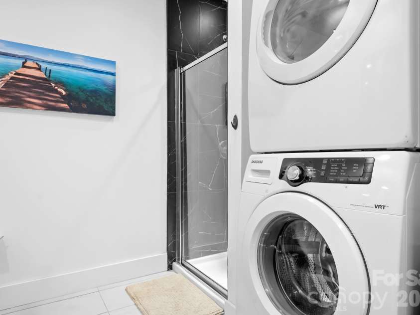 1611 Central Avenue, Charlotte, NC 28205.  MLS# CAR4378247, YatesRealty ID 22730. Stacked Full Size washer and Dryer will Convey! Located in large bathroom.