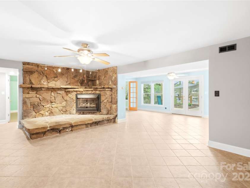 158 Regency Road, Mooresville, NC 28117.  MLS# CAR4242113, YatesRealty ID 22733. Basement main family room with enormous custom stone fireplace