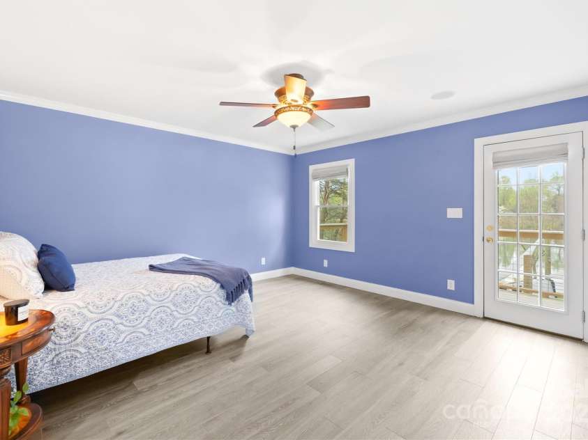 158 Regency Road, Mooresville, NC 28117.  MLS# CAR4242113, YatesRealty ID 22733. Primary bedroom overlooks the lake with a private balcony