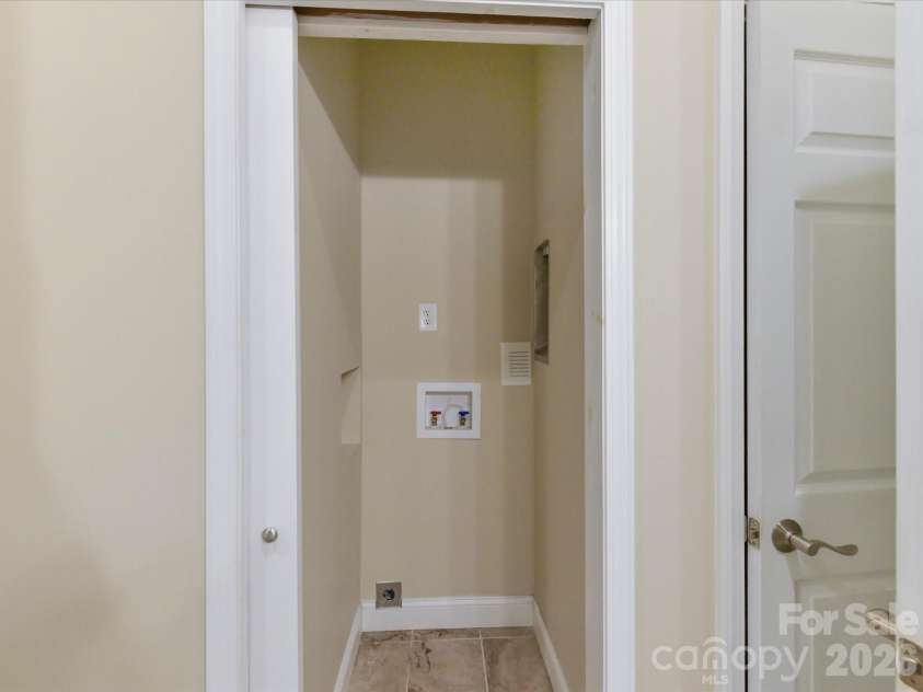 19040 Oakhurst Boulevard, Cornelius, NC 28031.  MLS# CAR4373641, YatesRealty ID 22748. Convenient second laundry hookup area with utility connections, perfect for added functionality and flexibility.