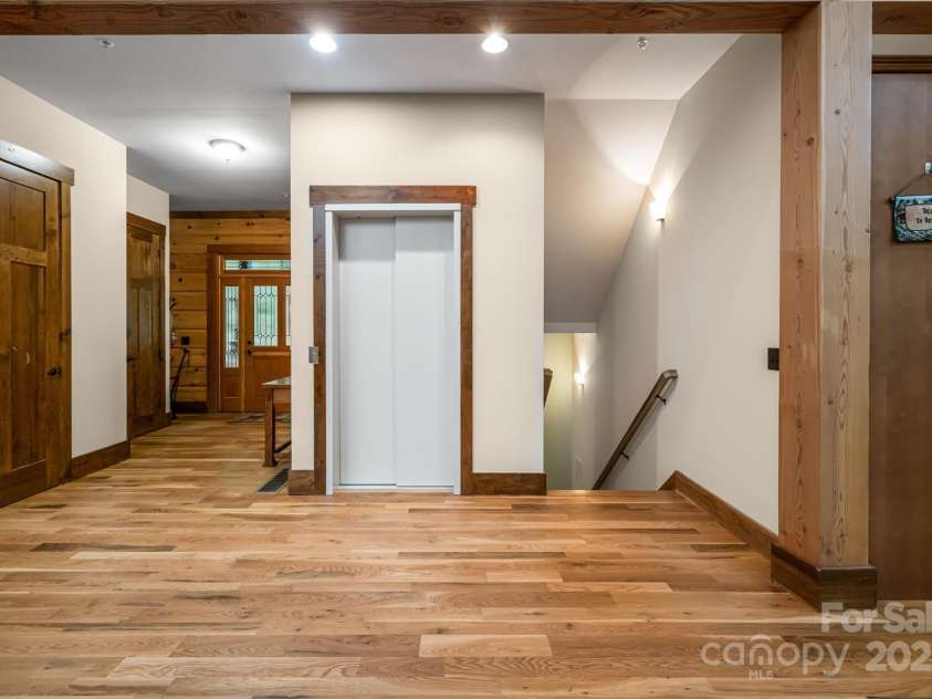 635 Whisper Mountain Drive, Leicester, NC 28748.  MLS# CAR4302796, YatesRealty ID 2275. Elevator access to all three levels — convenience meets luxury