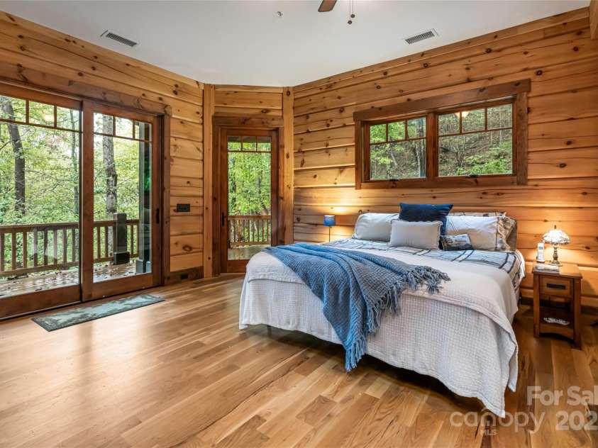 635 Whisper Mountain Drive, Leicester, NC 28748.  MLS# CAR4302796, YatesRealty ID 2275. Primary bedroom with walk in closet, ensuite bath