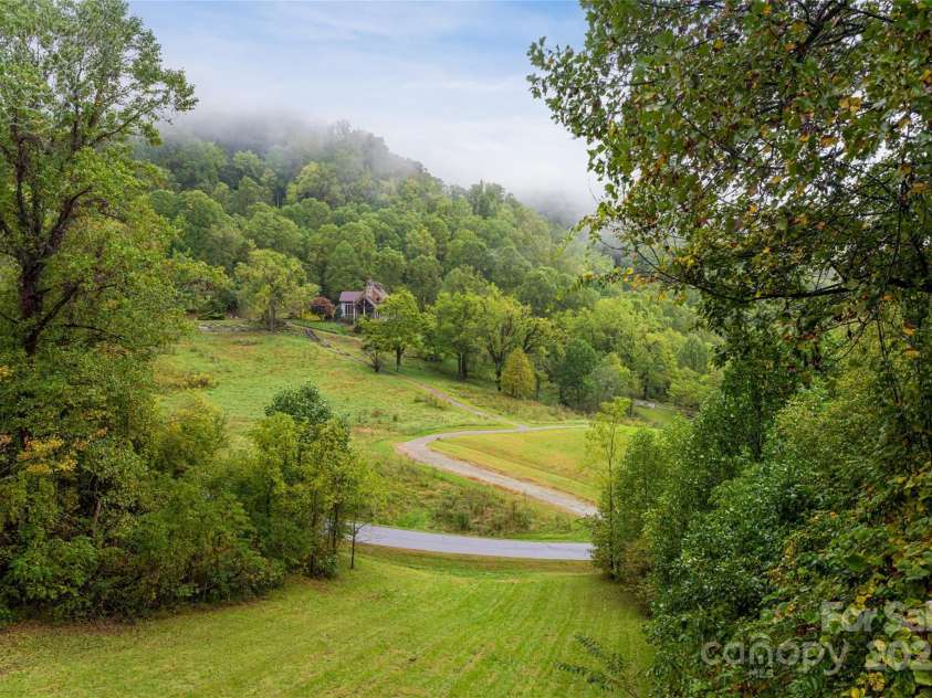 635 Whisper Mountain Drive, Leicester, NC 28748.  MLS# CAR4302796, YatesRealty ID 2275. Whisper Mountain amenities include hiking trails, a mountain lodge, wellness cabin, and acres of preserved forest and orchard 