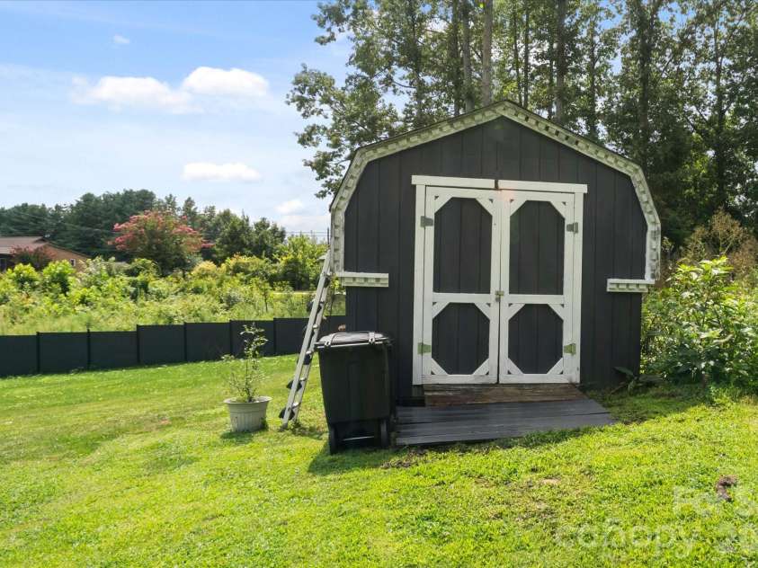 100 Victoria Springs Drive, Flat Rock, NC 28731.  MLS# CAR4411140, YatesRealty ID 22755. Storage Shed
