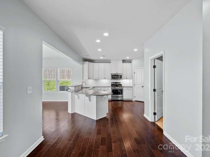 321 Almora Loop, Mooresville, NC 28115.  MLS# CAR4269481, YatesRealty ID 22755. Beautiful hand-scraped wood floors in the kitchen