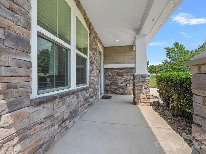 321 Almora Loop, Mooresville, NC 28115.  MLS# CAR4269481, YatesRealty ID 22755. Enjoy the rocking chair front porch