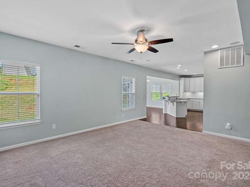321 Almora Loop, Mooresville, NC 28115.  MLS# CAR4269481, YatesRealty ID 22755. Family room flows into the gourmet kitchen