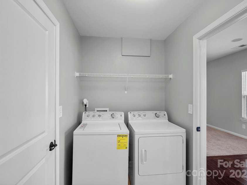 321 Almora Loop, Mooresville, NC 28115.  MLS# CAR4269481, YatesRealty ID 22755. Laundry room off the garage - washer & dryer convey with accepted offer