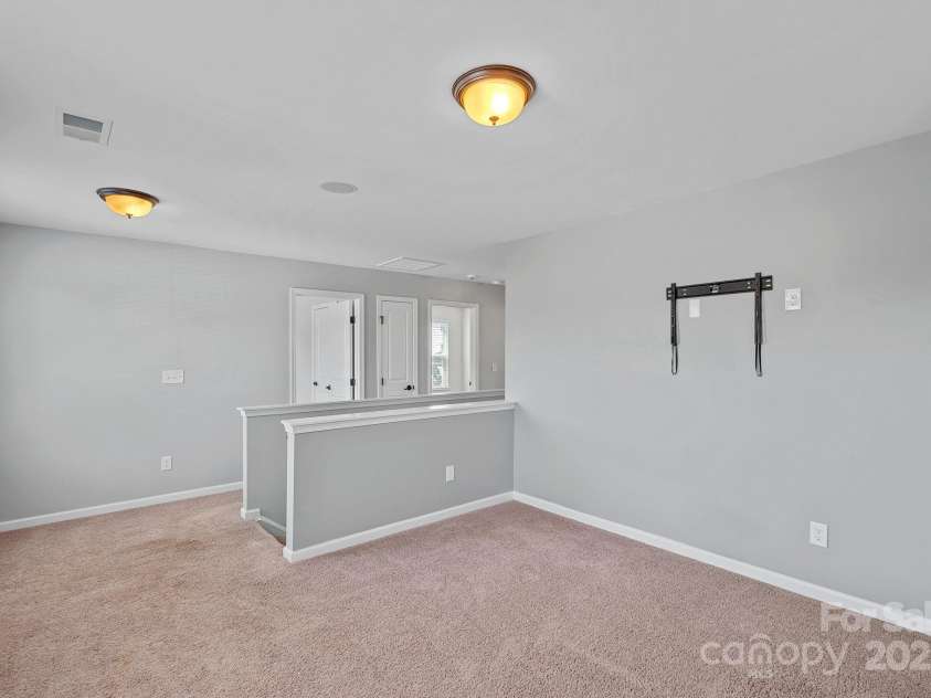 321 Almora Loop, Mooresville, NC 28115.  MLS# CAR4269481, YatesRealty ID 22755. Nice loft area upstairs with wireless speakers - could be entertainment area or office space