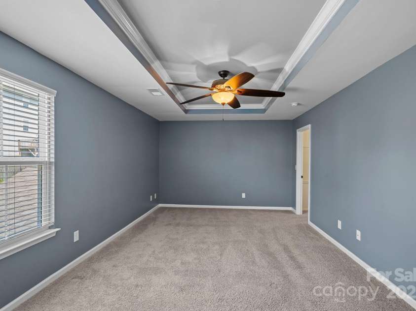 321 Almora Loop, Mooresville, NC 28115.  MLS# CAR4269481, YatesRealty ID 22755. Spacious primary suite with walk-in closet and ensuite bathroom