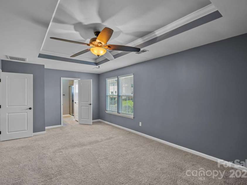321 Almora Loop, Mooresville, NC 28115.  MLS# CAR4269481, YatesRealty ID 22755. Spacious primary suite with walk-in closet and ensuite bathroom