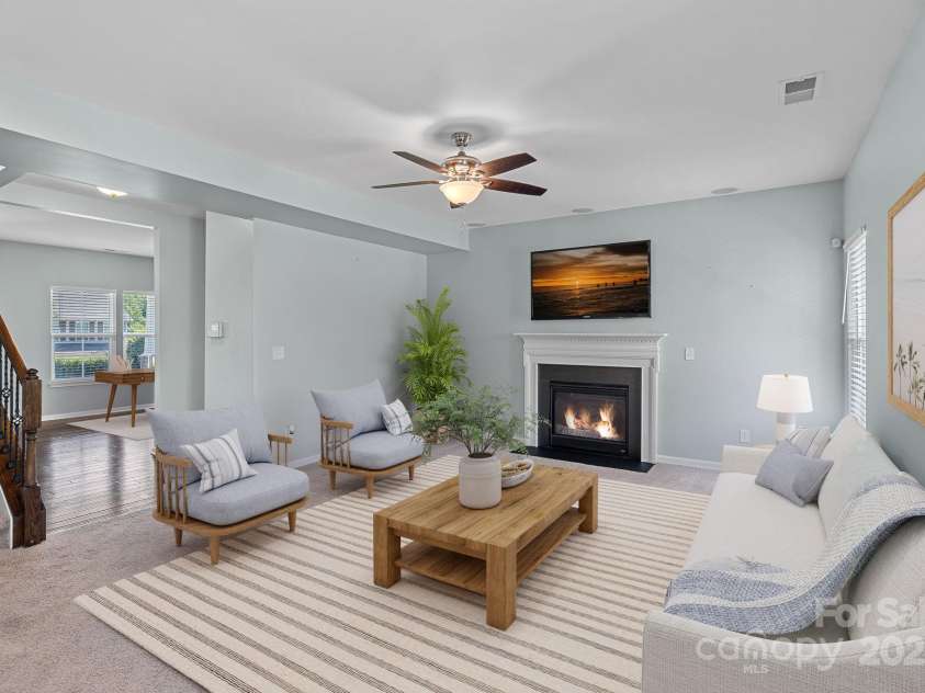 321 Almora Loop, Mooresville, NC 28115.  MLS# CAR4269481, YatesRealty ID 22755. Virtually staged - Large family room with in-ceiling speakers