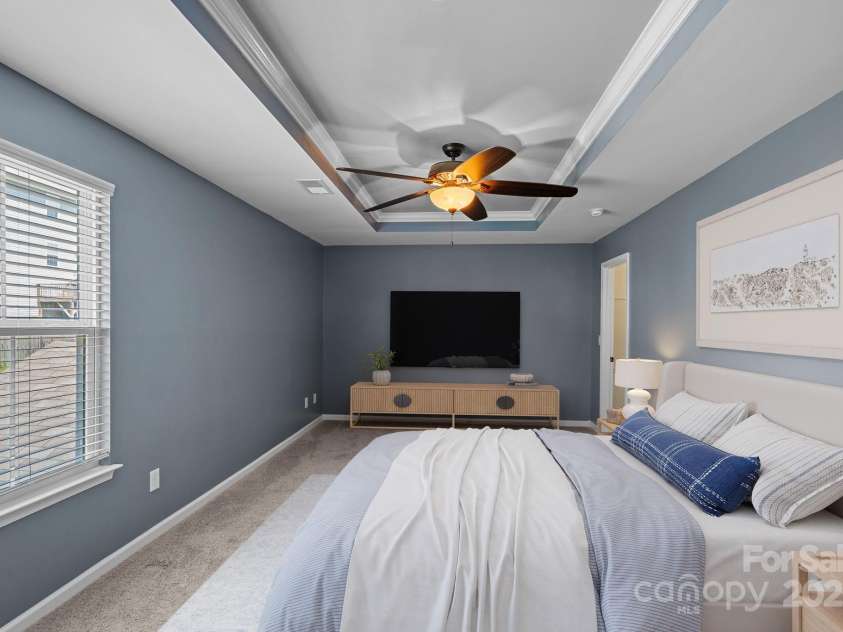 321 Almora Loop, Mooresville, NC 28115.  MLS# CAR4269481, YatesRealty ID 22755. Virtually staged - Spacious primary suite with walk-in closet and ensuite bathroom