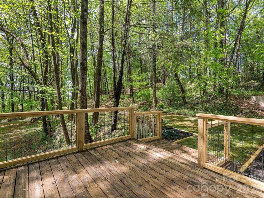 209 Ivy Hill Road, Hendersonville, NC 28792.  MLS# CAR4376204, YatesRealty ID 22760. Deck off Primary Bedroom