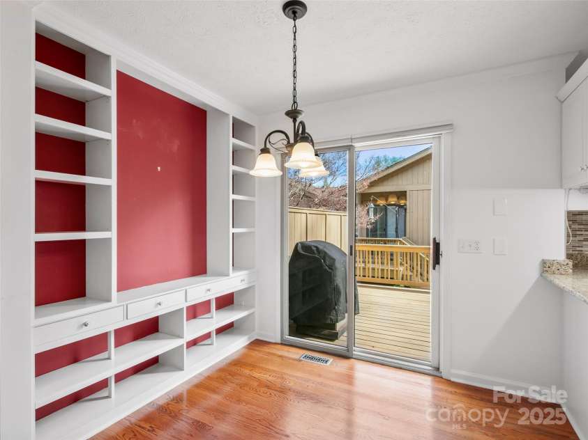 205 Wild Oak Lane, Hendersonville, NC 28791.  MLS# CAR4240419, YatesRealty ID 22765. Breakfast Room with built in shelves