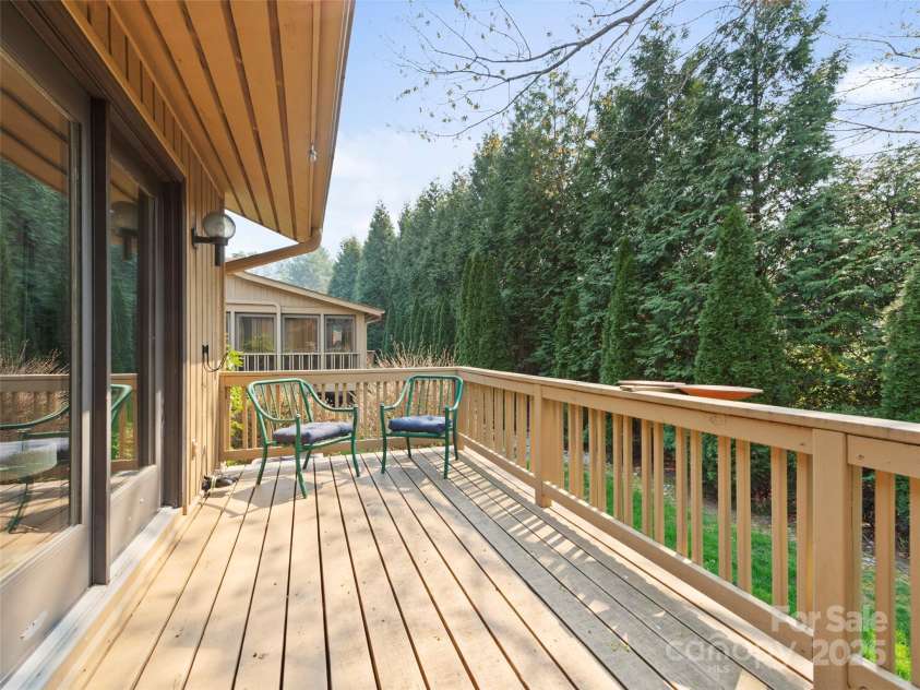 205 Wild Oak Lane, Hendersonville, NC 28791.  MLS# CAR4240419, YatesRealty ID 22765. Deck off Living Room and Screened in Porch