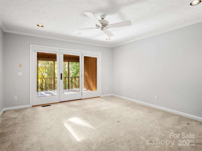 205 Wild Oak Lane, Hendersonville, NC 28791.  MLS# CAR4240419, YatesRealty ID 22765. Primary Bedroom opens to screened in porch.