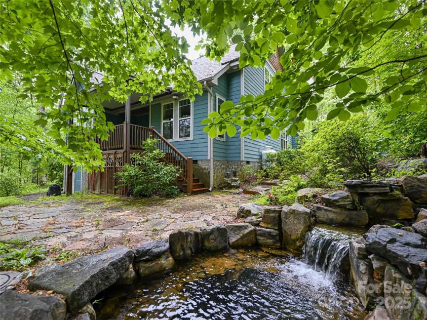 17 Bohemian Lane, Asheville, NC 28805.  MLS# CAR4243280, YatesRealty ID 22766. Relax on the covered back deck and listen to the water fall
