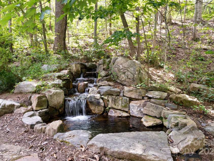 17 Bohemian Lane, Asheville, NC 28805.  MLS# CAR4293074, YatesRealty ID 22766. Calming Sound Of Water * Gorgeous Stone Work