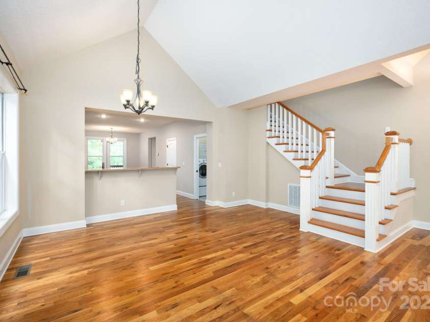 17 Bohemian Lane, Asheville, NC 28805.  MLS# CAR4293074, YatesRealty ID 22766. Living Room Flows to Dining and Kitchen