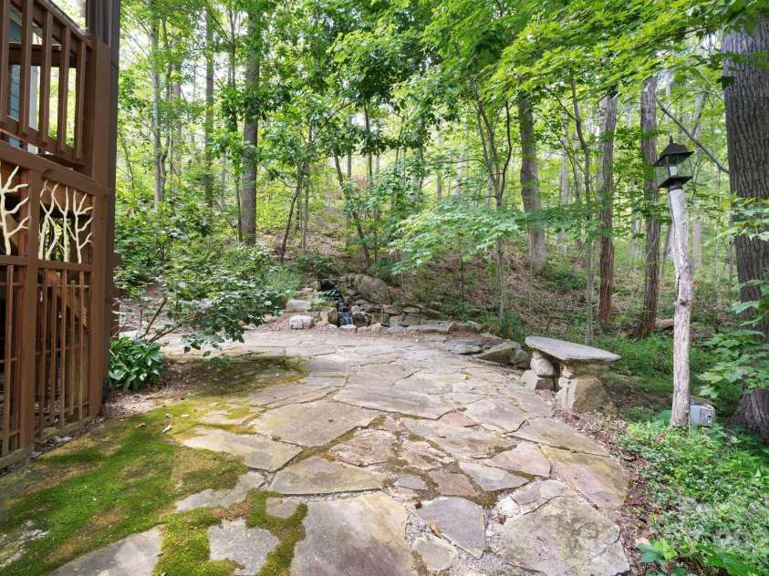 17 Bohemian Lane, Asheville, NC 28805.  MLS# CAR4293074, YatesRealty ID 22766. Patio Overlooks Waterfall and Pond