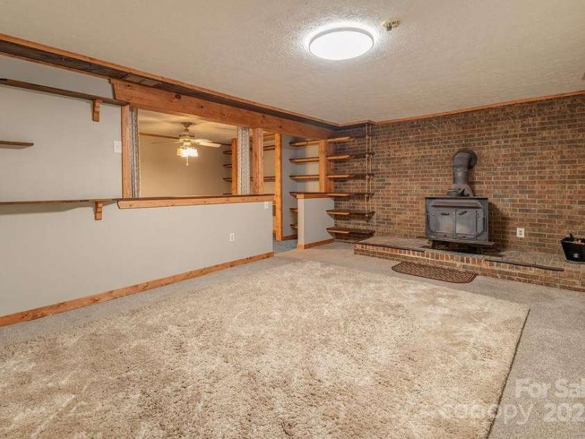 1 Spring Hill Drive, Hendersonville, NC 28792.  MLS# CAR4247945, YatesRealty ID 22767. Basement Den / Family Room