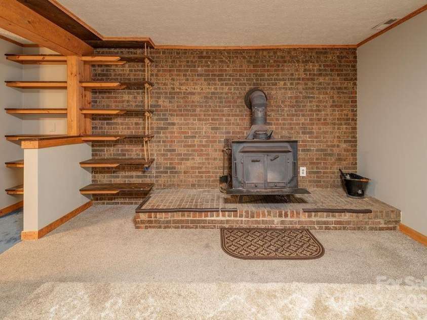 1 Spring Hill Drive, Hendersonville, NC 28792.  MLS# CAR4247945, YatesRealty ID 22767. Basement Den / Family Room