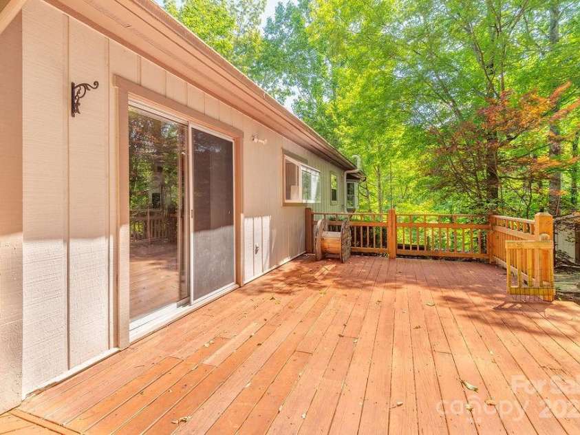 1 Spring Hill Drive, Hendersonville, NC 28792.  MLS# CAR4247945, YatesRealty ID 22767. Large Back Deck off dining area
