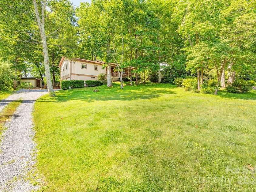 1 Spring Hill Drive, Hendersonville, NC 28792.  MLS# CAR4247945, YatesRealty ID 22767. Large front lawn