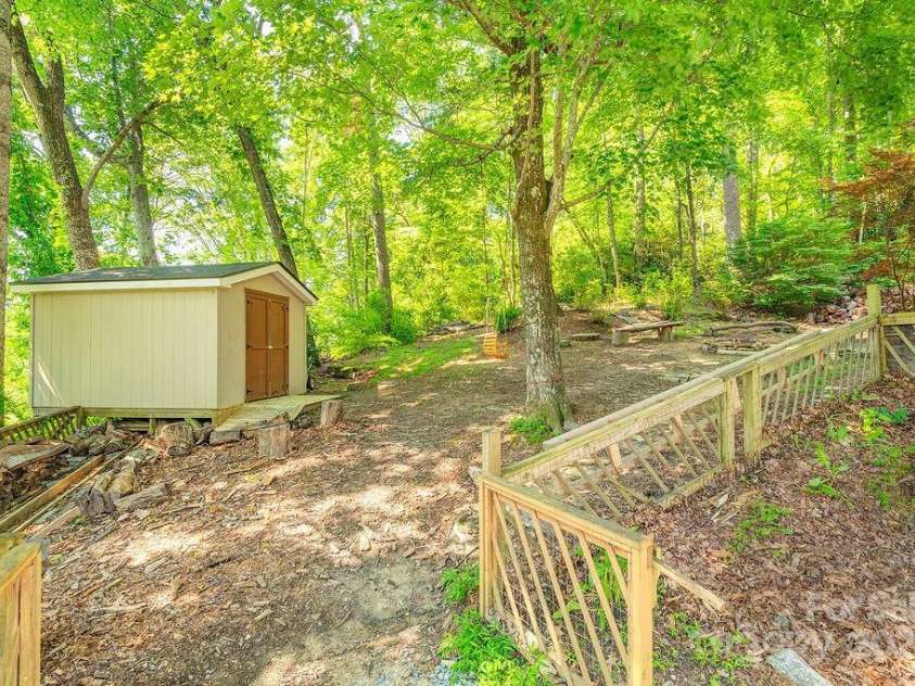 1 Spring Hill Drive, Hendersonville, NC 28792.  MLS# CAR4247945, YatesRealty ID 22767. Storage Shed