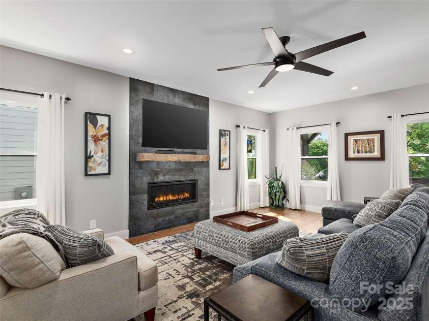 156 Joyner Avenue, Asheville, NC 28806.  MLS# CAR4273987, YatesRealty ID 22779. Great room w/ sleek fireplace