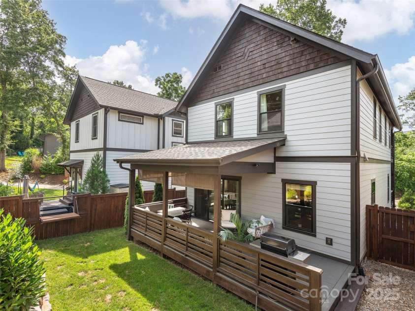 156 Joyner Avenue, Asheville, NC 28806.  MLS# CAR4273987, YatesRealty ID 22779. Pass-thru fence opening and awnings down!