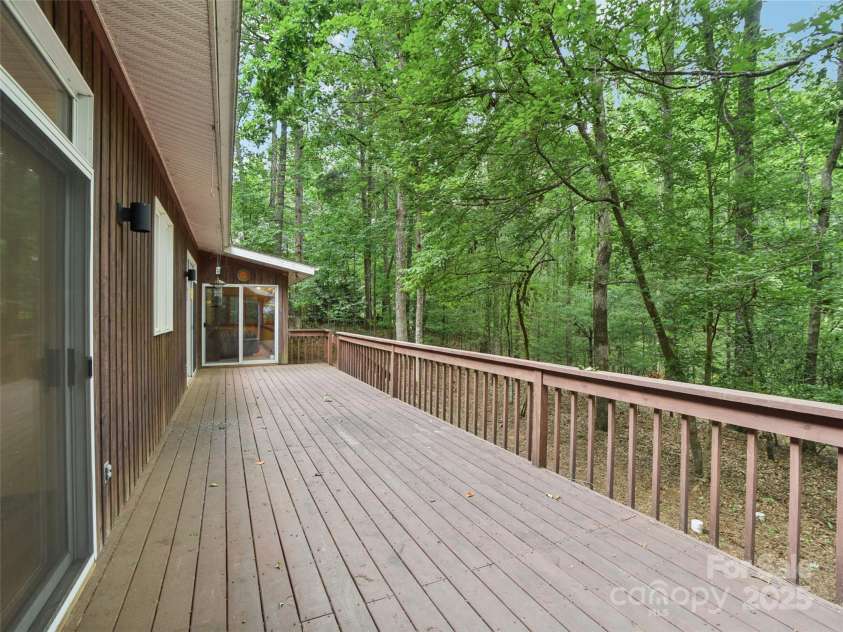 105 Sunningdale Drive, Flat Rock, NC 28731.  MLS# CAR4274018, YatesRealty ID 22781. Back Deck with doors off Kitchen, Dining Room, Sunroom and Primary Bedroom