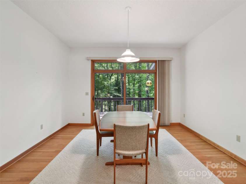 105 Sunningdale Drive, Flat Rock, NC 28731.  MLS# CAR4274018, YatesRealty ID 22781. Dining Room connected to Living Room