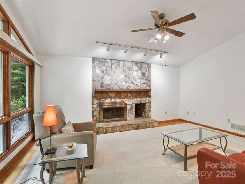 105 Sunningdale Drive, Flat Rock, NC 28731.  MLS# CAR4274018, YatesRealty ID 22781. Family Room with Wood Burning Fireplace off Foyer